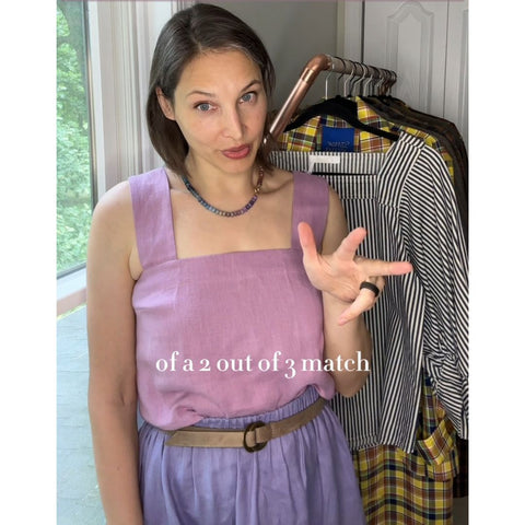 Style for Substance founder Susan Janeczko wearing a linen top in pink and a linen skirt in purple with a grey belt. 