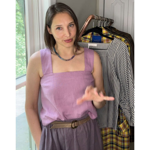 Style for Substance founder Susan Janeczko wearing a pink linen top with a pink linen skirt in a darker and lower chroma color with a grey belt. 