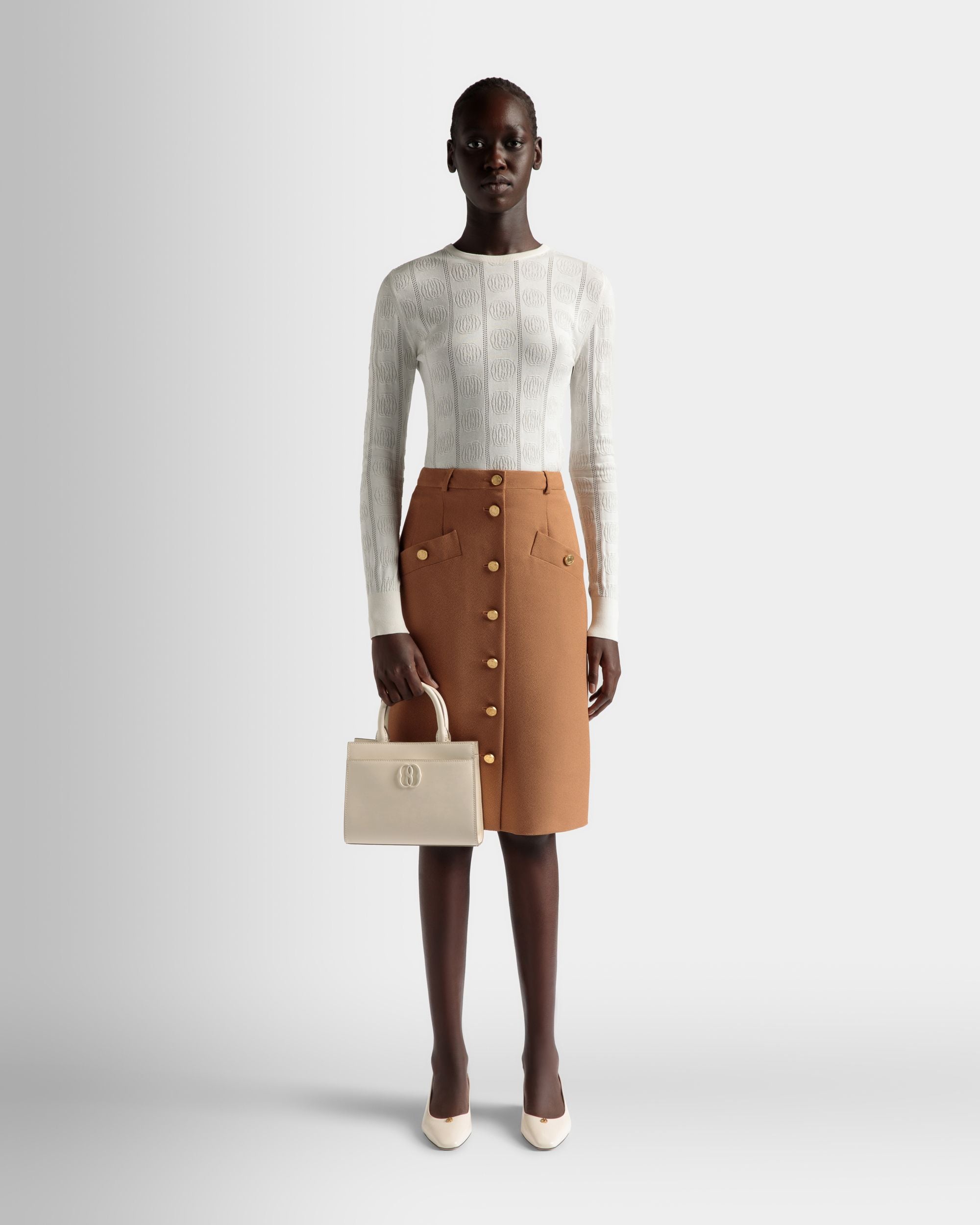 Emblem | Women's Small Tote Bag in White Brushed Leather | Bally | On Model Front