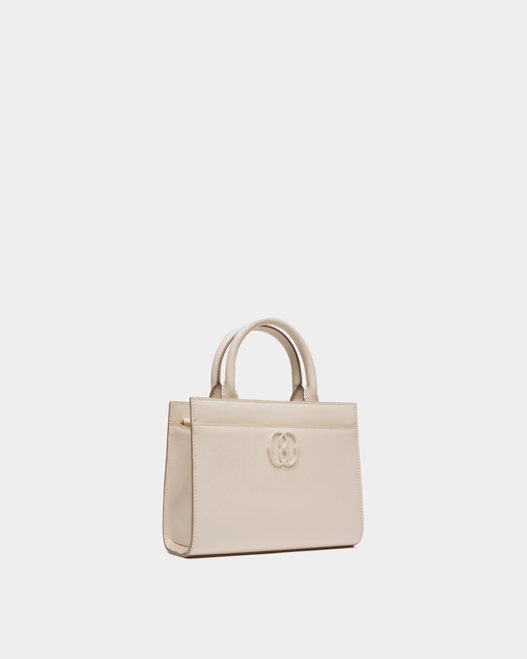 Emblem | Women's Small Tote Bag in White Brushed Leather | Bally | Still Life 3/4 Front