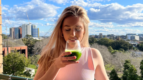 @georgia_bounds drinking matcha on her balcony