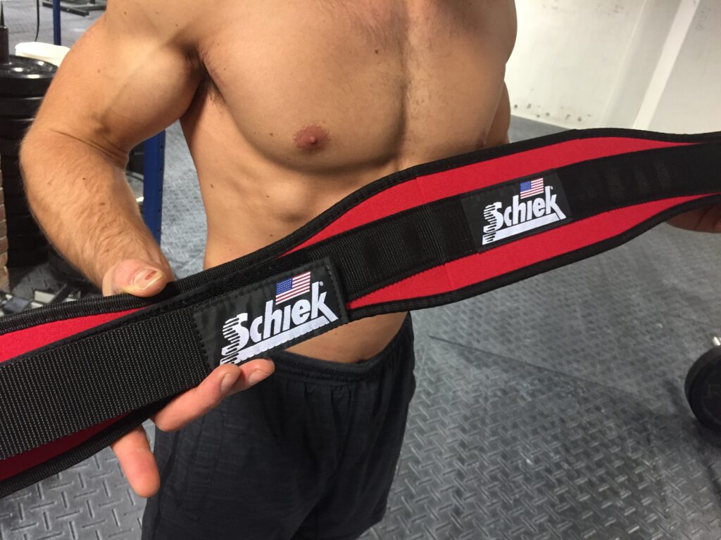 SCHIEK Contoured Lifting Belt held up - red