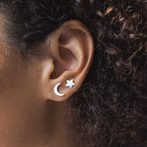 Matching moon and star earrings made with sustainable recycled silver from canadian brand