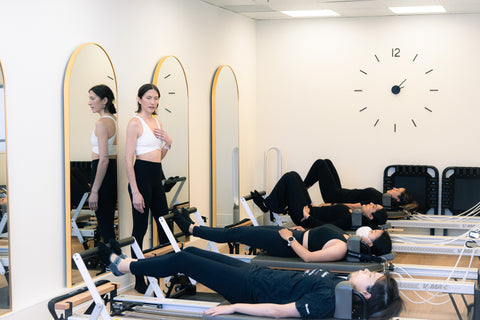Reformer pilates class based in GTA neutral pilates with instructor teaching