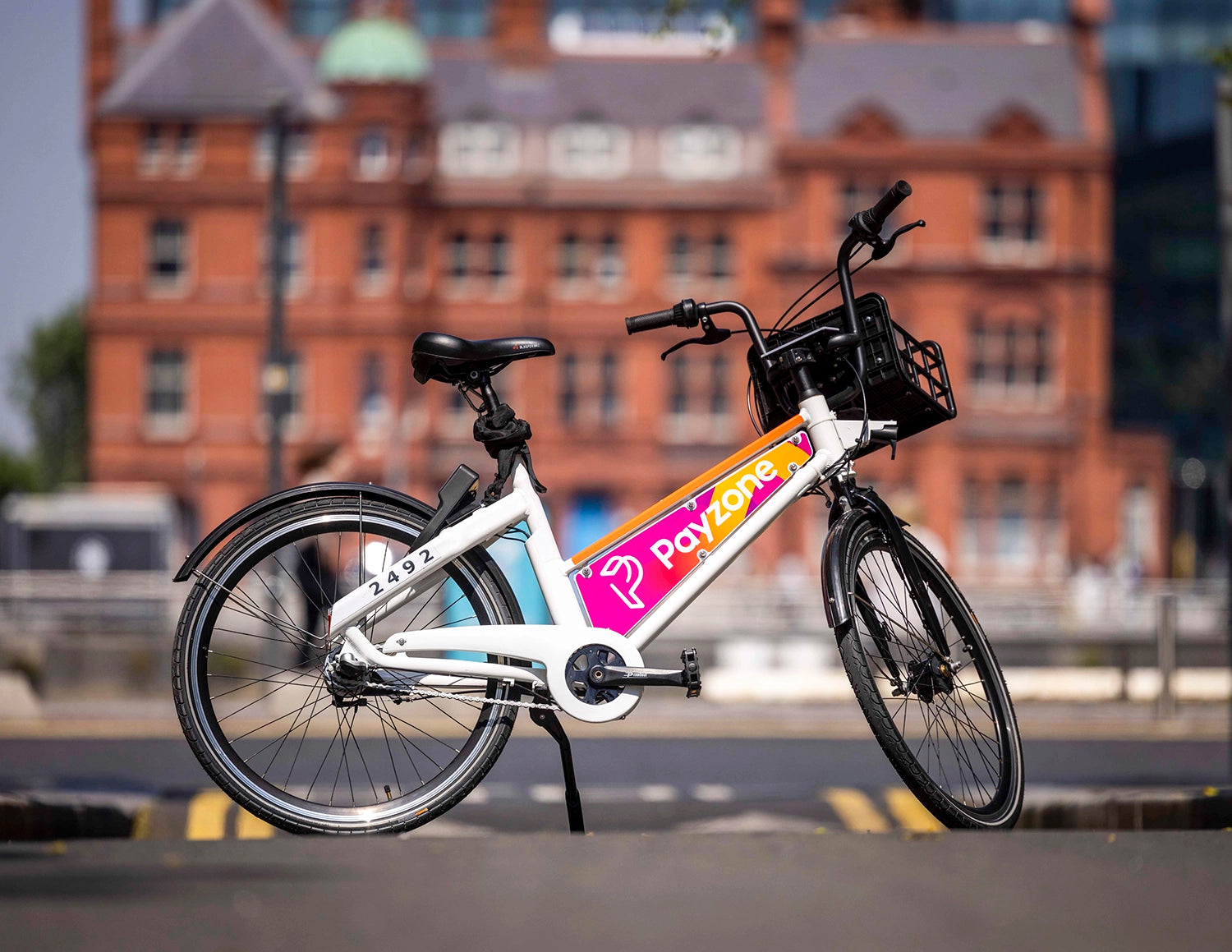 A photo of a Bleeper shared public bike with Payzone branding on its adboard. 