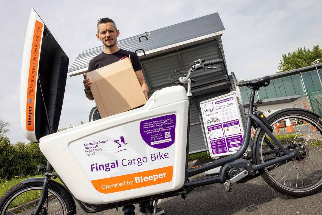 A man loads a box into the cargo hold of the Fingal Shared Cargo bike in Mountview. The cargo bike is operated by Bleeper, and can be hired using the Bleeper app.