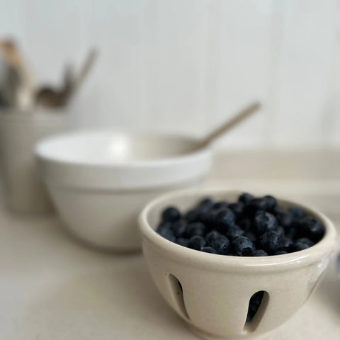 white stoneware bowl filled with blueberries