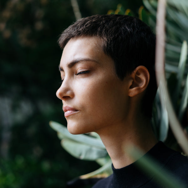 Woman breathing outside