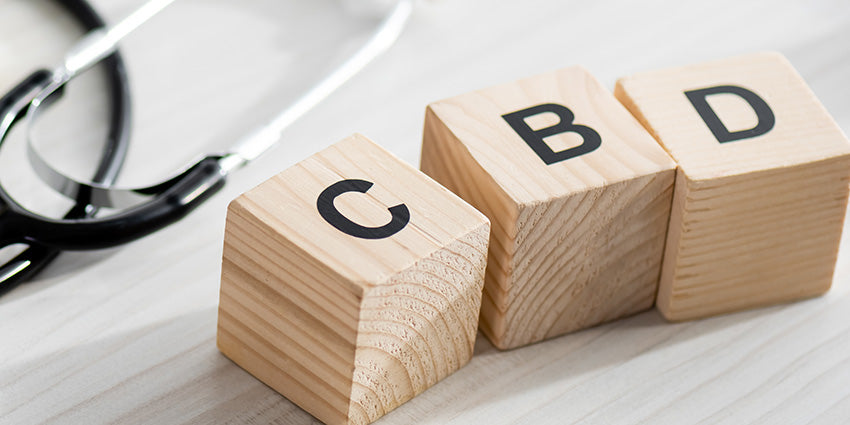Wooden dice spelling CBD. Buy CBD + CBN cannabinoids for sleep and insomnia relief from Oscity CBD gummies.