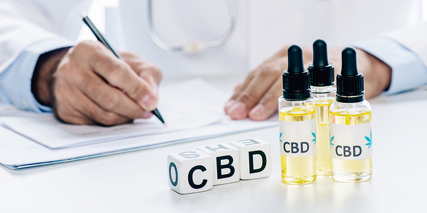 Doctor writing about how to use CBD and CBDV tinctures for Energy