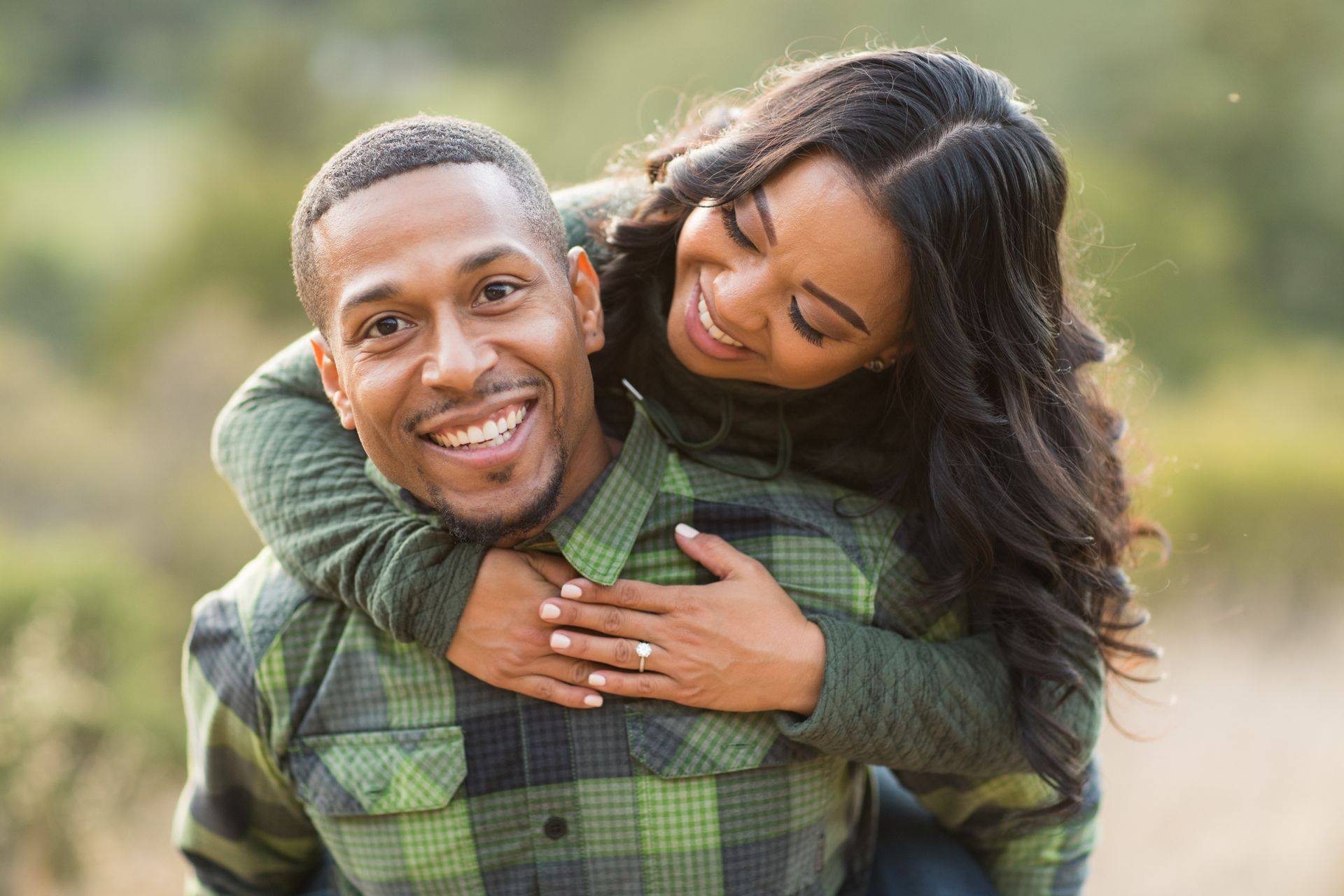 Couples posing for an engagement session