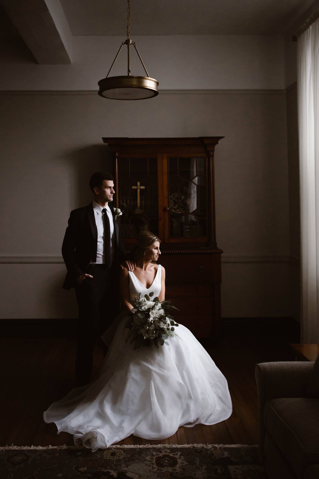 A bride and groom posing for a classic wedding portrait