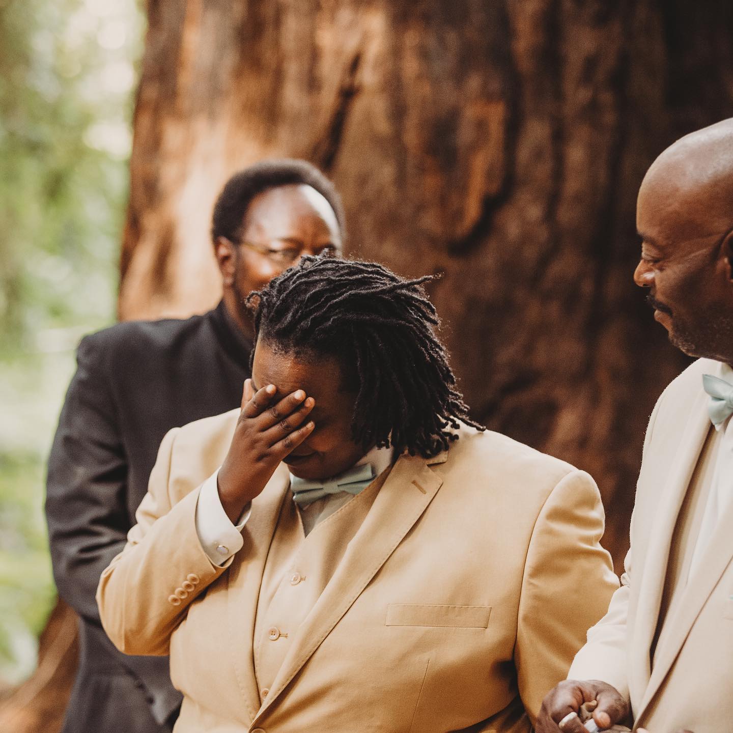 A portrait of person getting emotional at a wedding