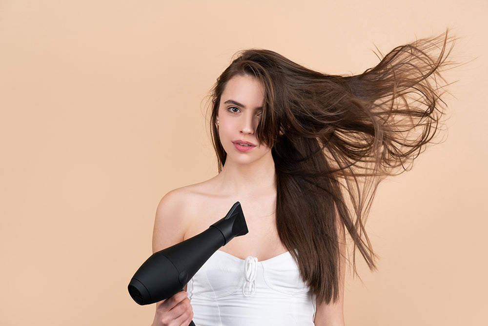 does blow drying your hair damage it