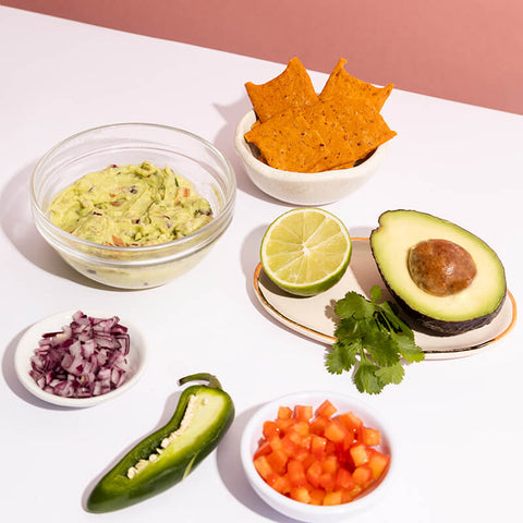 Guacamole with nachos, showing the ingredients needed for the recipe.