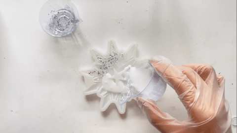 Cover the rest of the snowflake with white resin mixture