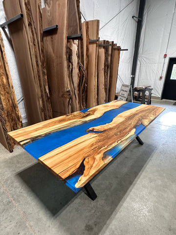 Blue Resin river table made from spalted maple slabs.
