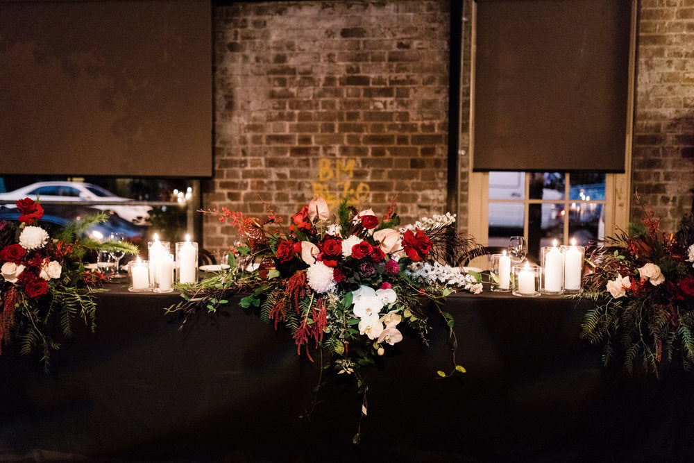 flowers and candles on bridal table at bar m sydney rushcutters bay