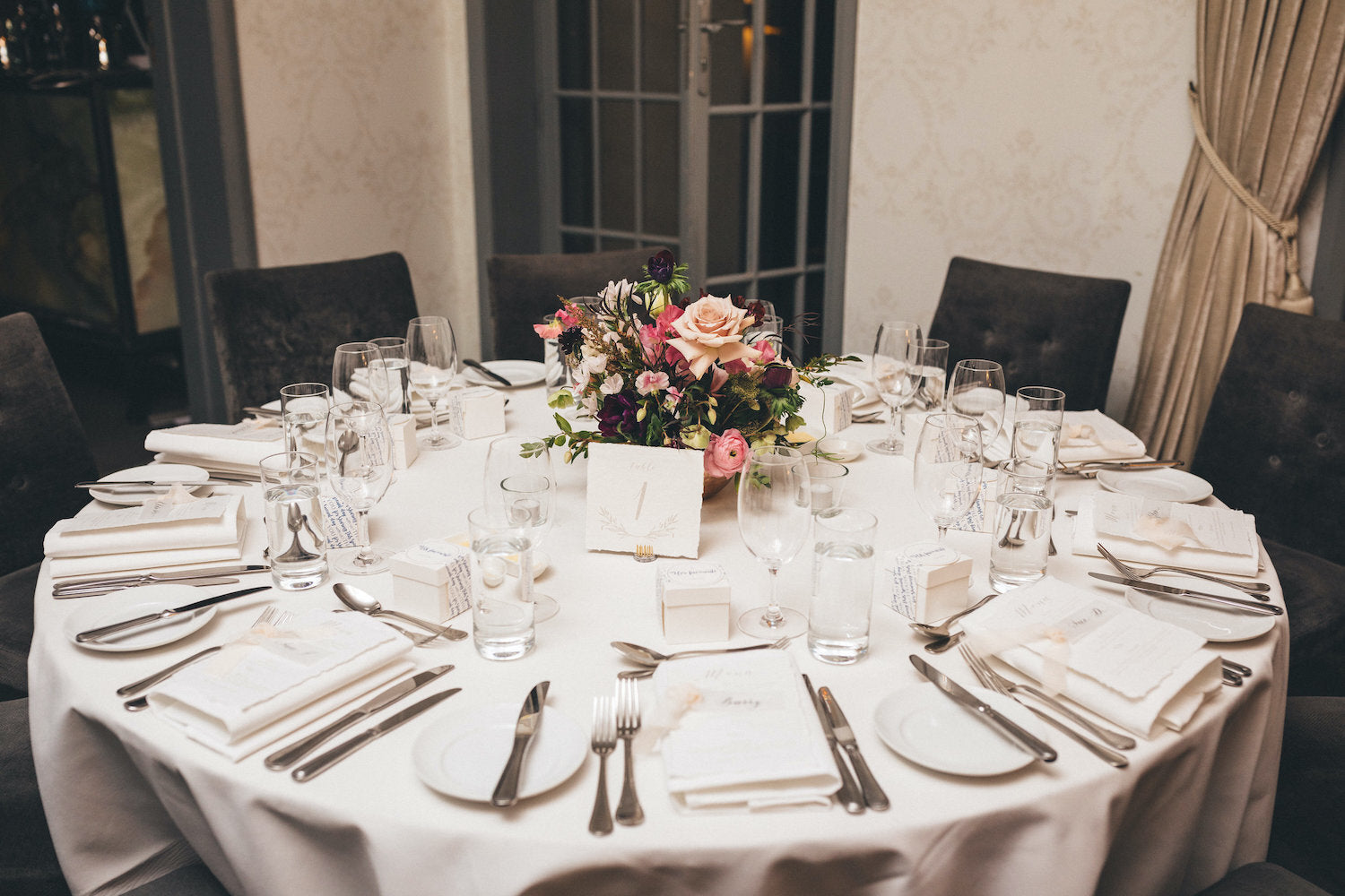 table setting with flowers and table number gunners barracks wedding