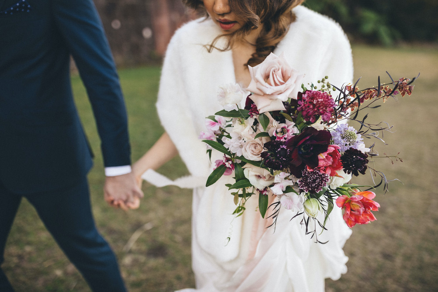 bride holding flowers at gunners barracks wedding