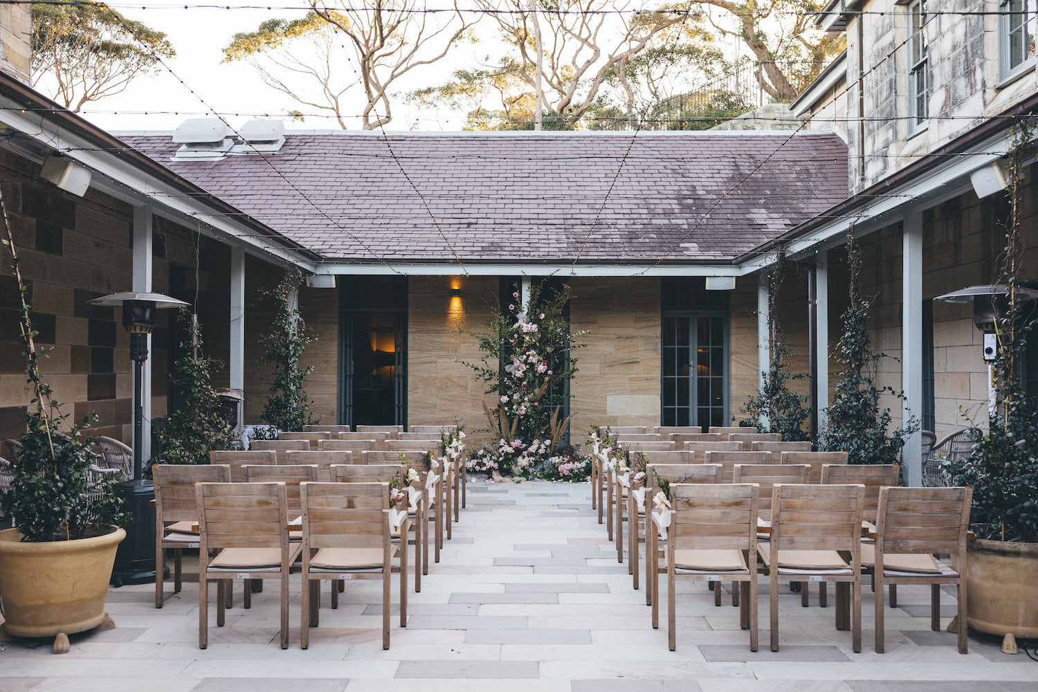 sydney wedding ceremony courtyard floral arch backdrop gunner barracks