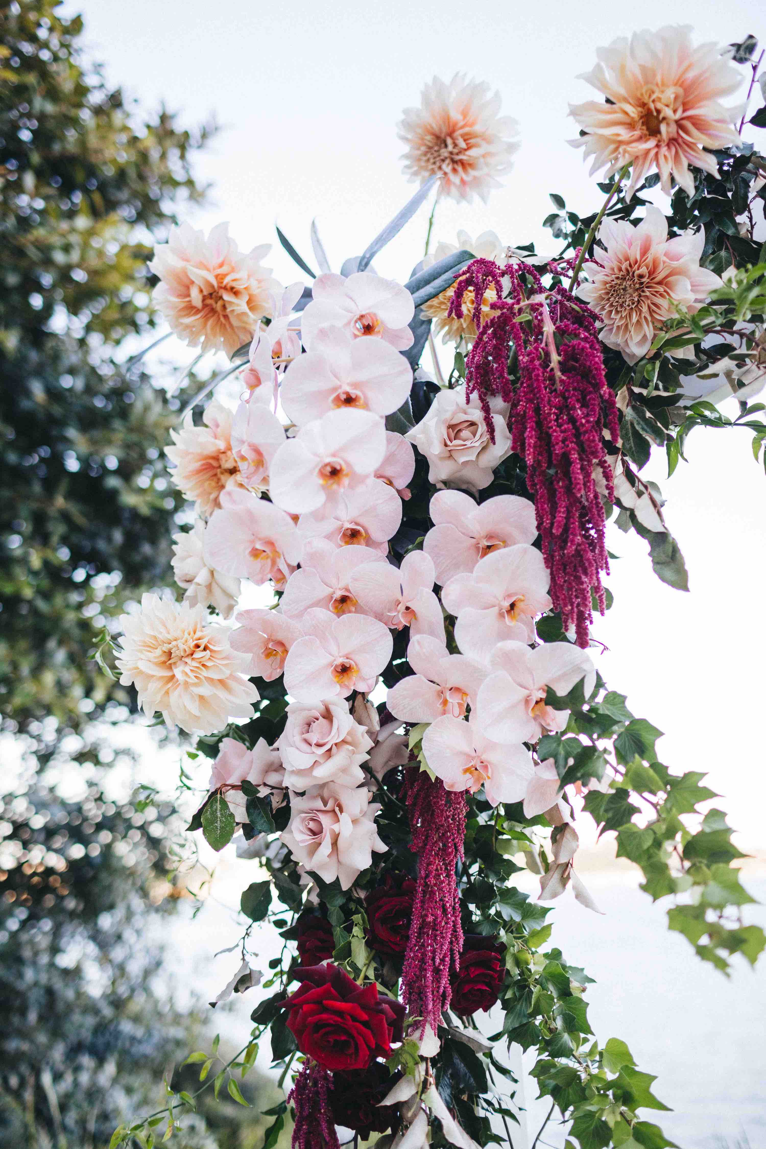 close up flowers orchids dahalias amaranthus ceremony arch sergeants mess wedding