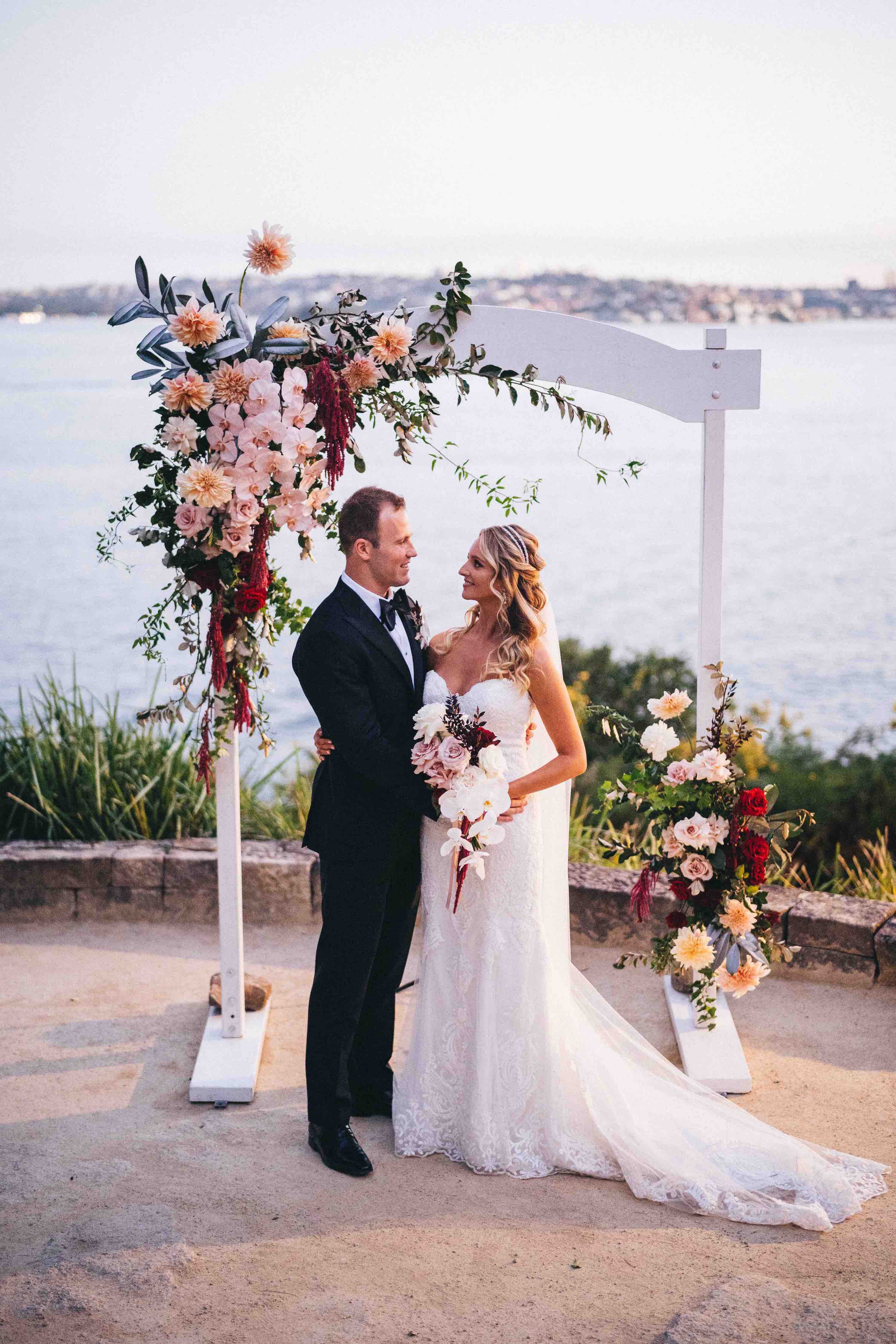 sydney couple wedding ceremony arch flowers sergeants mess sunset