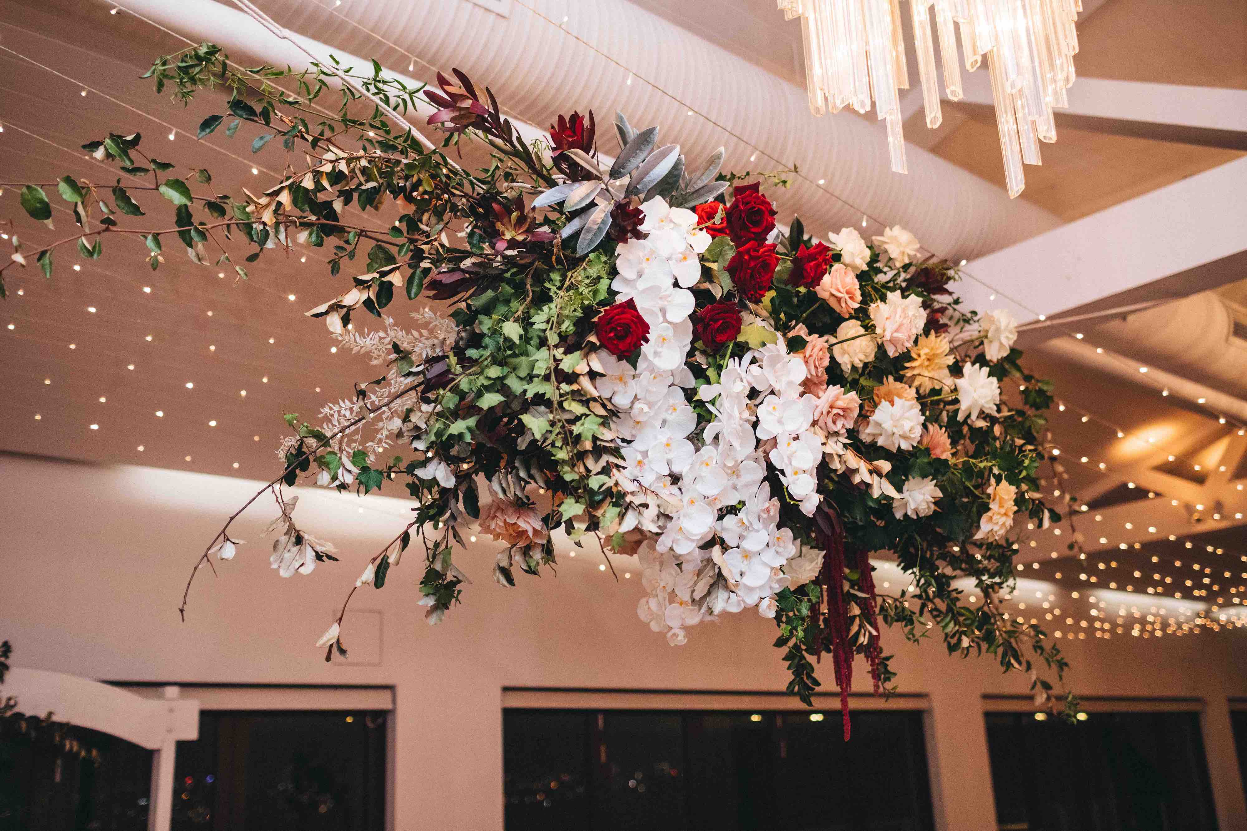 ceiling flower installation at sergeants mess wedding reception