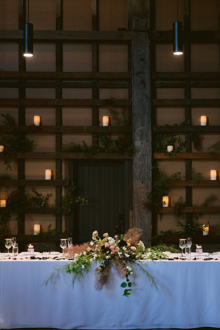 back wall candles greenery behind bridal table centrepiece flowers ovolo woolloomooloo