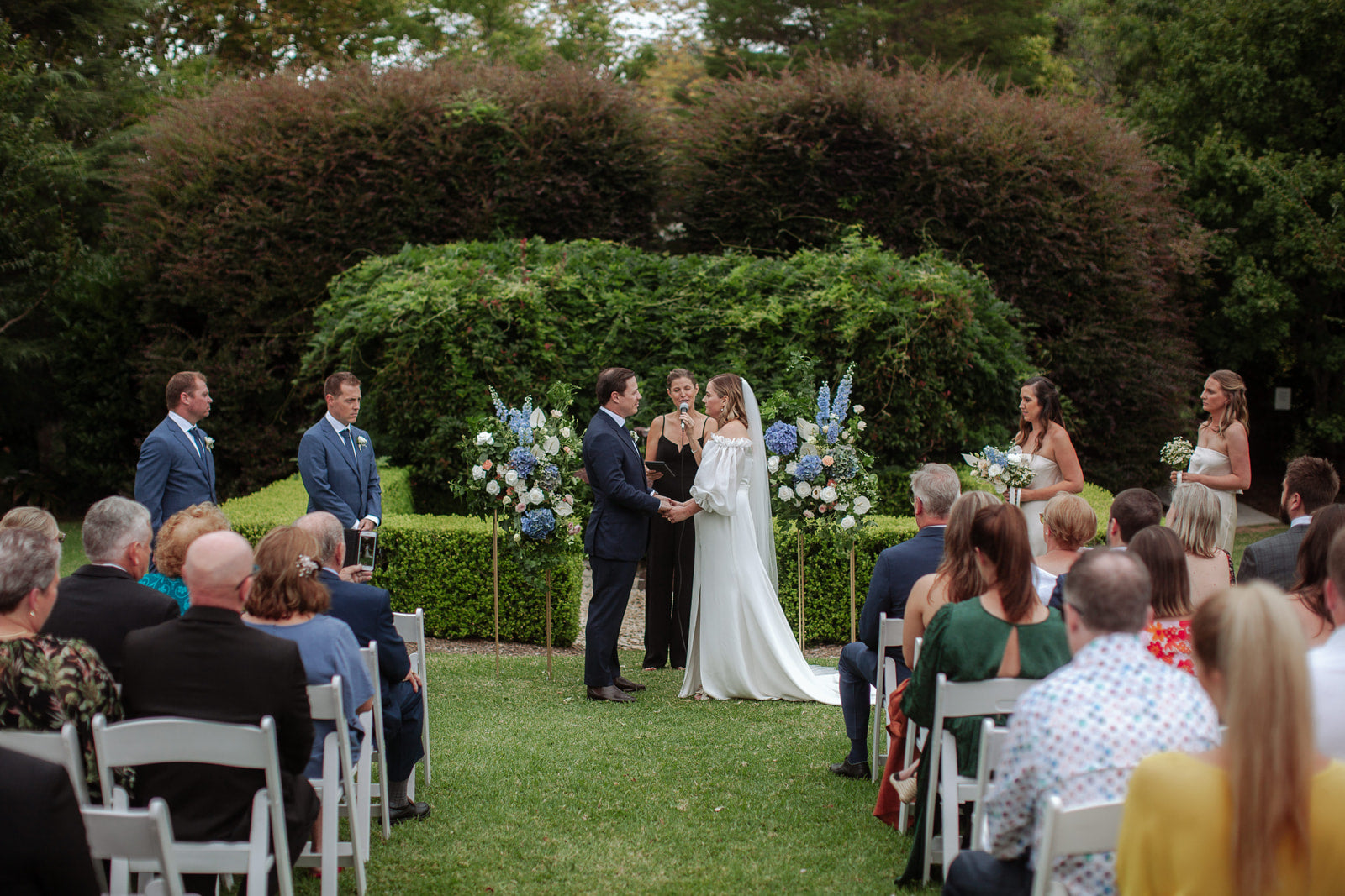 garden outdoor wedding ceremony bells at killcare