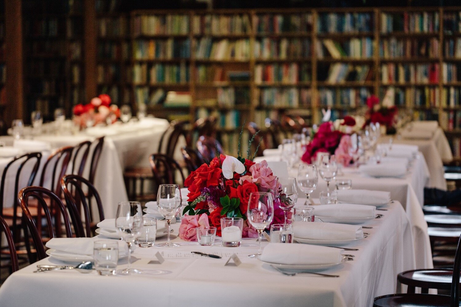 low flower centrepieces on tables at bendooley book barn wedding