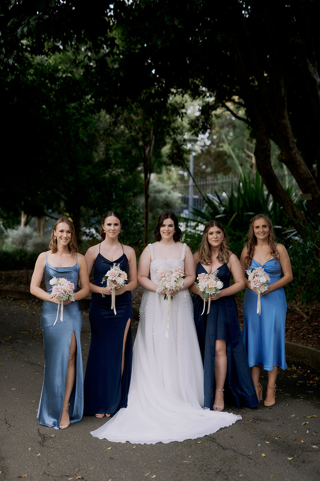 bride with gradient ombre blue navy bridesmaid dresses royal botanic gardens sydney