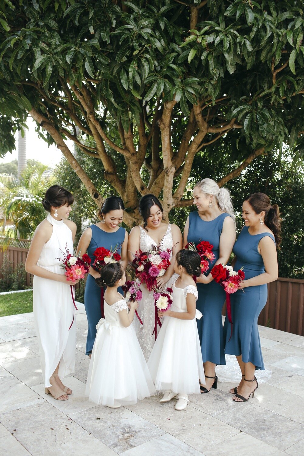 bride and bridesmaids with wedding flowers
