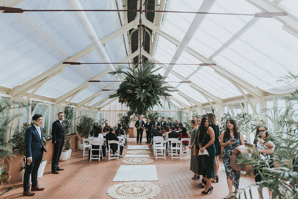 inside palm house botanic gardens sydney wedding ceremony boho greenery tropical