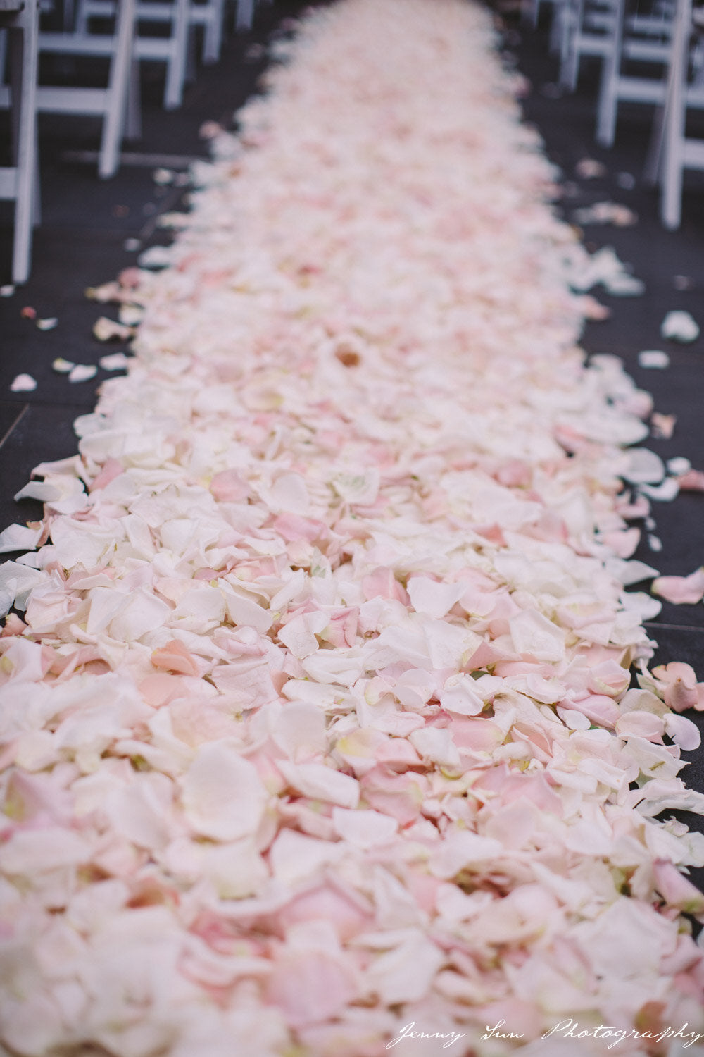 ceremony aisle filled with fresh rose petals
