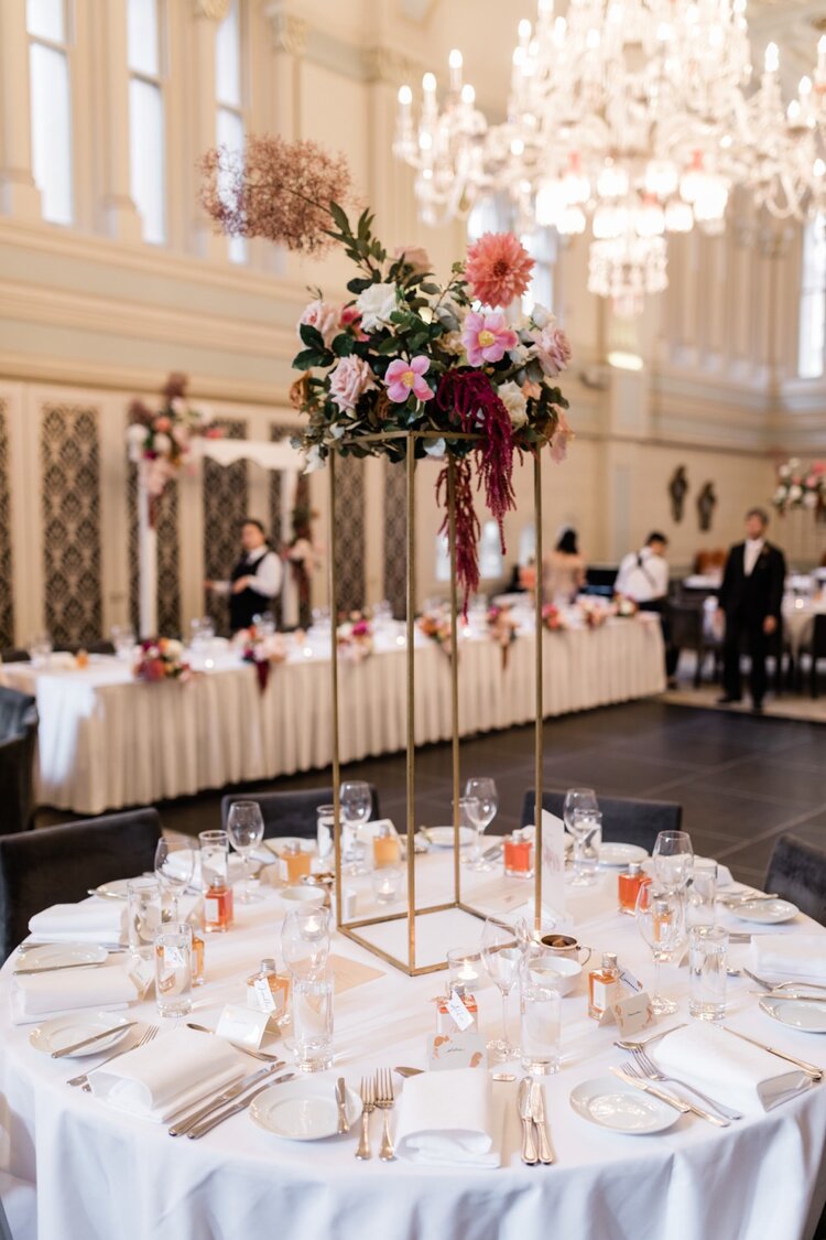 tall flower stand centrepiece table at qvb tea room wedding