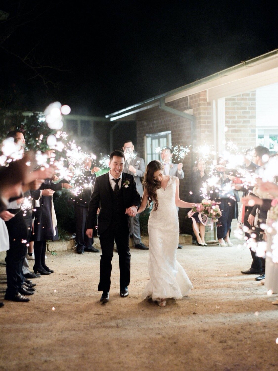 couple leaving reception sparklers send off milton park