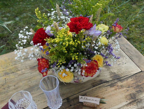 Country wedding inspiration table, flowers in tangy colored tureen