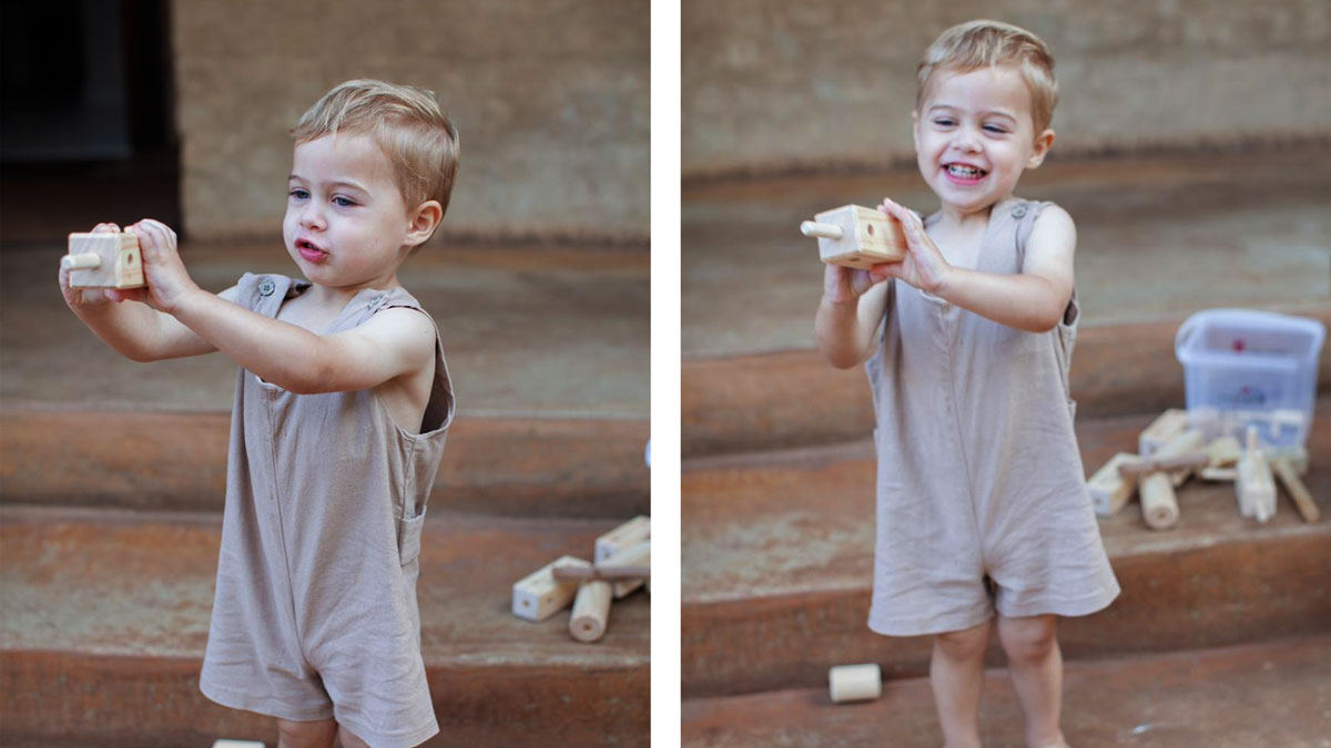 boy with wooden toy