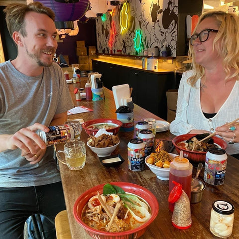 Two Tribes staff Mike Shuster and Jess Ayres enjoy a Metroland Tokyo Session IPA and Ramen at Bone Daddies in London