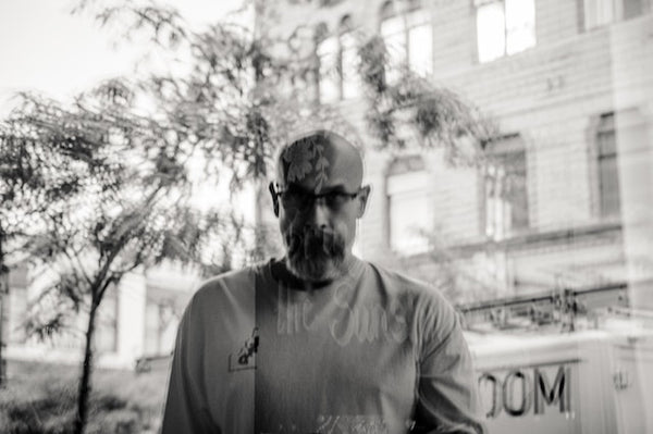 Gray-scale Photography of Man wearing Eyeglasses