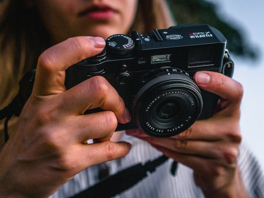 Woman holding Fujifilm Camera by Matt Hardy | Pexels