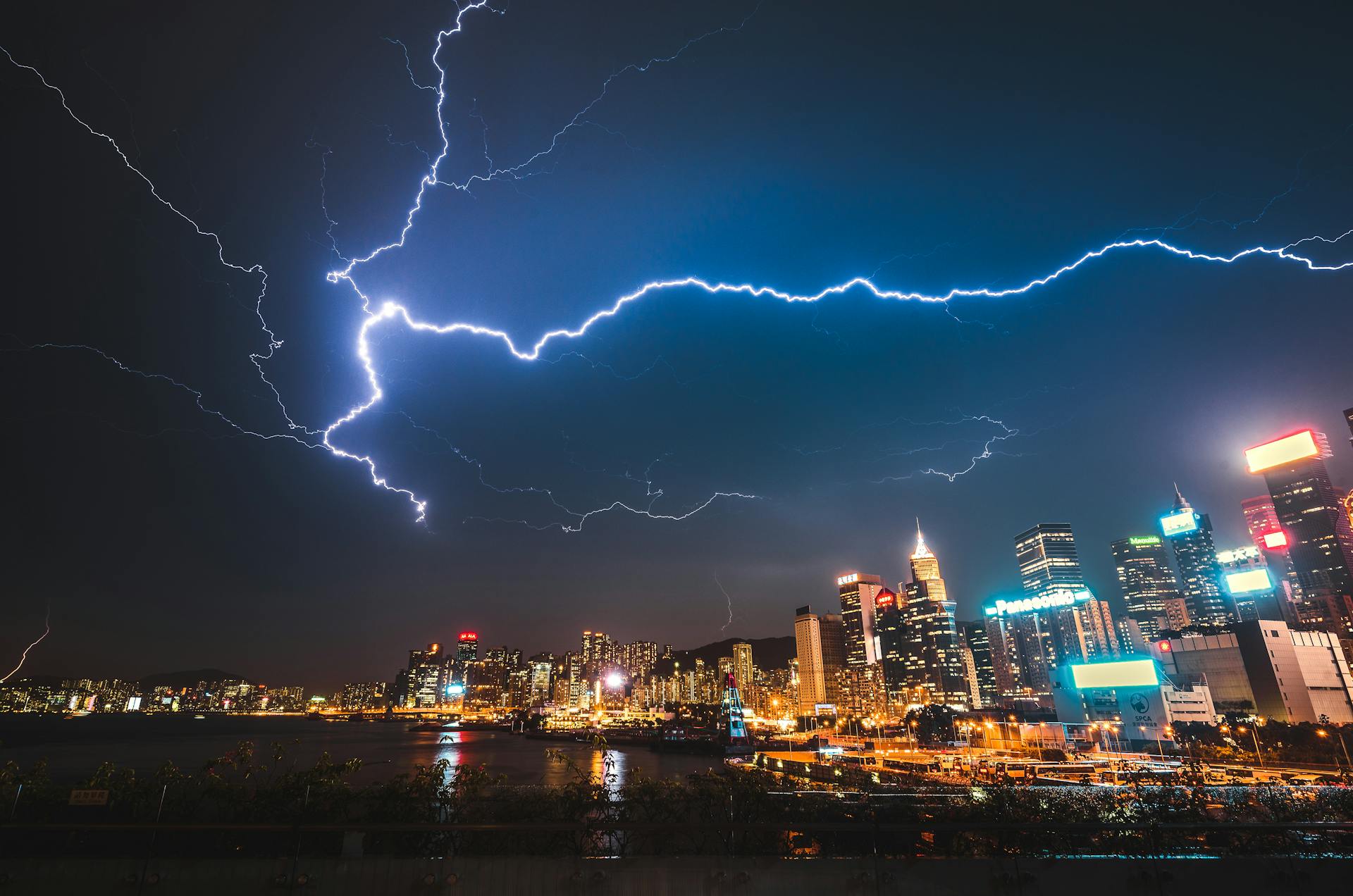 Lightning over city by Nick Kwan