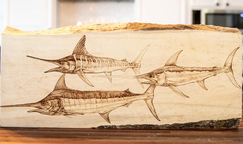 offshore fishing artwork - work in progress wood burning of billfish slam by mokie burns