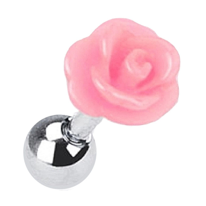 A 16 gauge acrylic pink rose cartilage earring with a surgical steel barbell and ball pictured against a white fabric background.