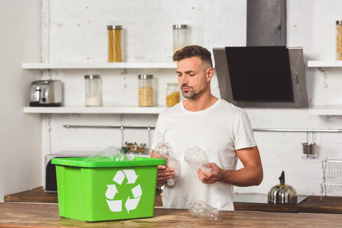 man recycling plastic