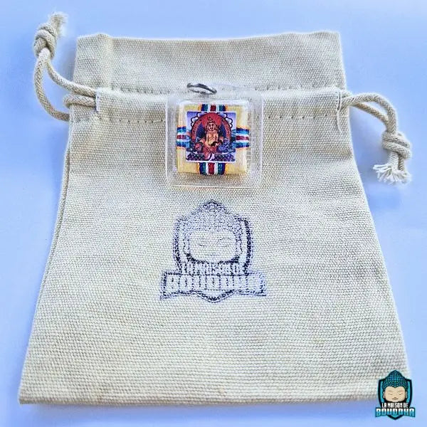 Amulette Yantra du Bouddha de fortune Tibétain Dzambhala sur ca pochette en lin