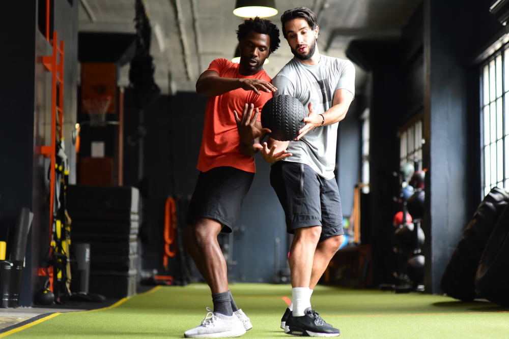 slam ball one arm chest pass