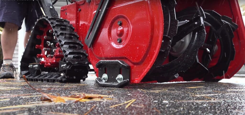 A ground-level look at the tracks and auger on a ceramic coated Toro unit being tested by YouTube channel Silver Cymbal. Photo Credit: Silver Cymbal/YouTube