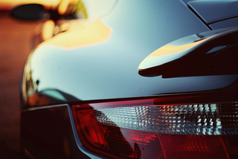 a close up of the rear end of a sports car